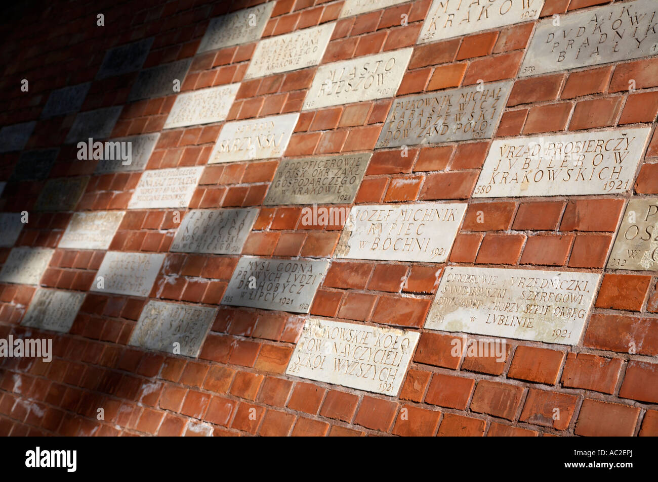 commemorative sponsor plaques buried in the wall of wawel castle krakow Stock Photo