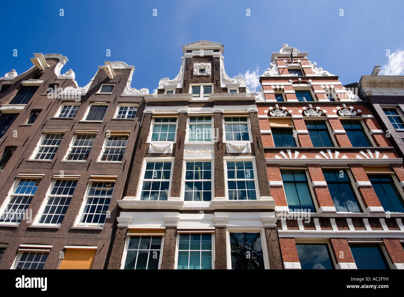 Amsterdam Damrak traditional architecture canalside houses Stock Photo