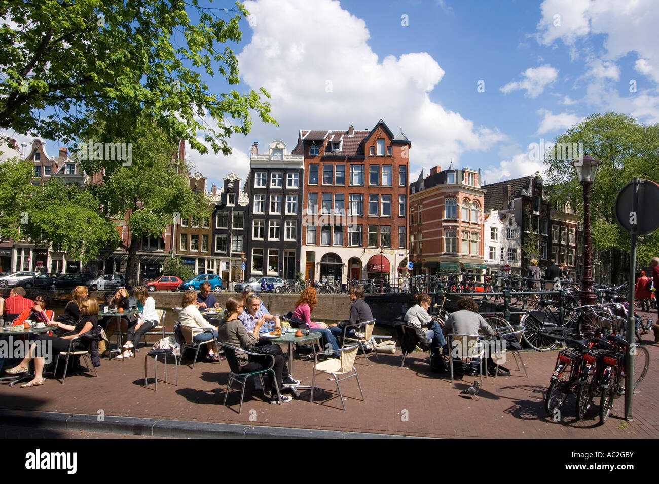 Amsterdam street cafe at a canal typical architecture Stock Photo