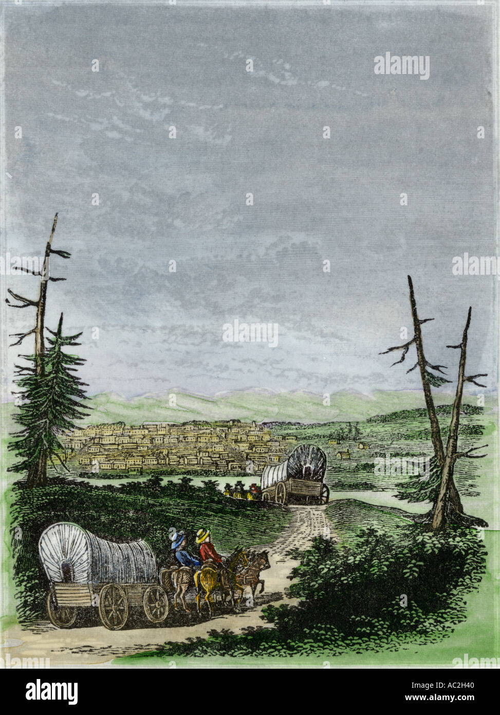 Covered wagons coming into Santa Fe New Mexico on the Santa Fe Trail 1850s. Hand-colored engraving Stock Photo
