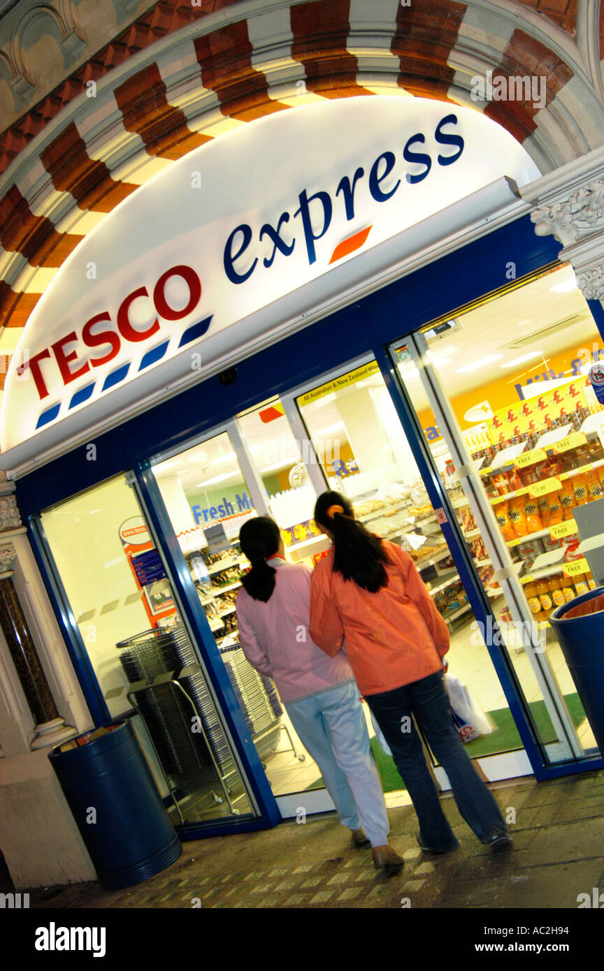 Tesco Express store at night open till late, London UK Stock Photo