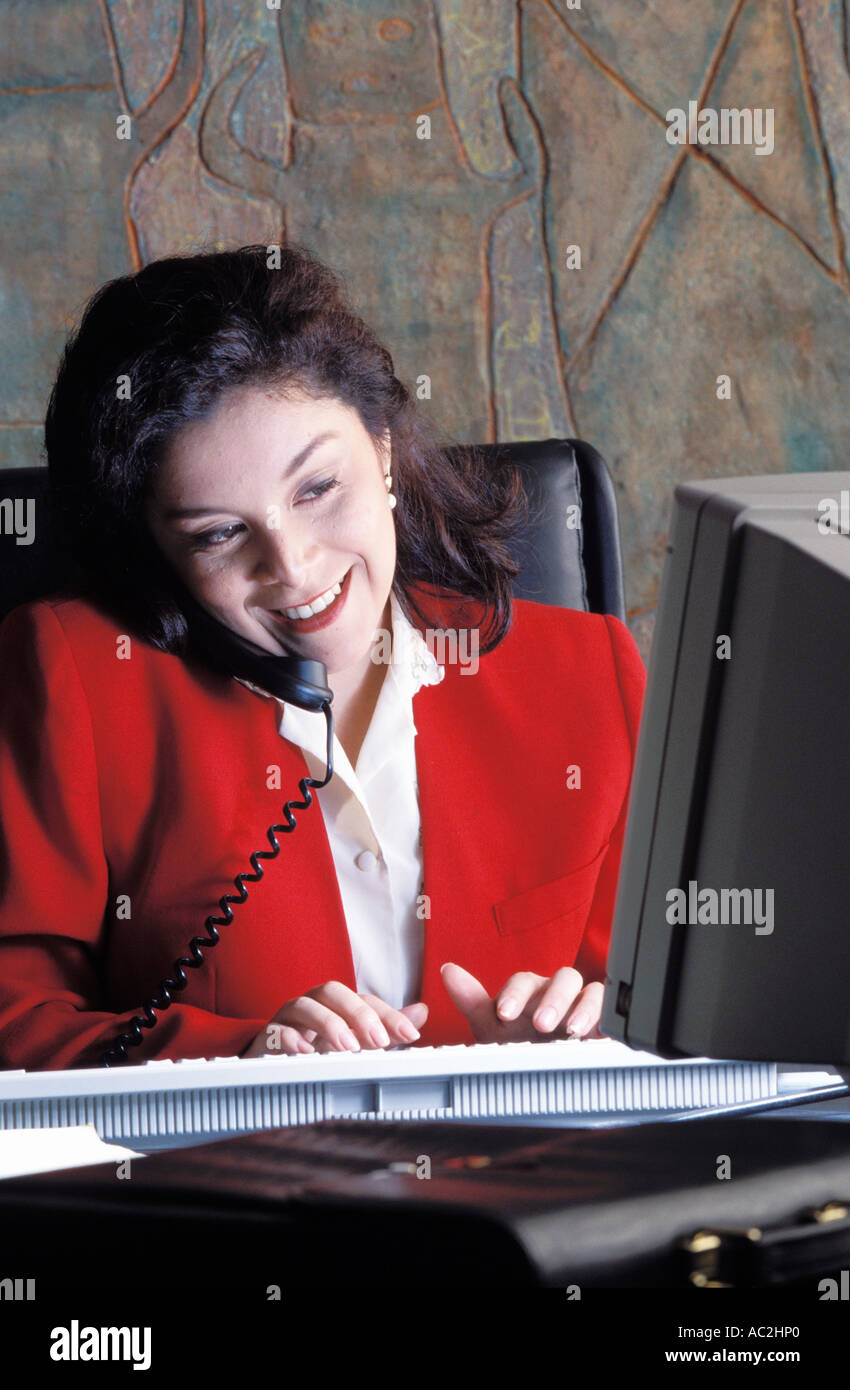 Woman working at her desk Stock Photo