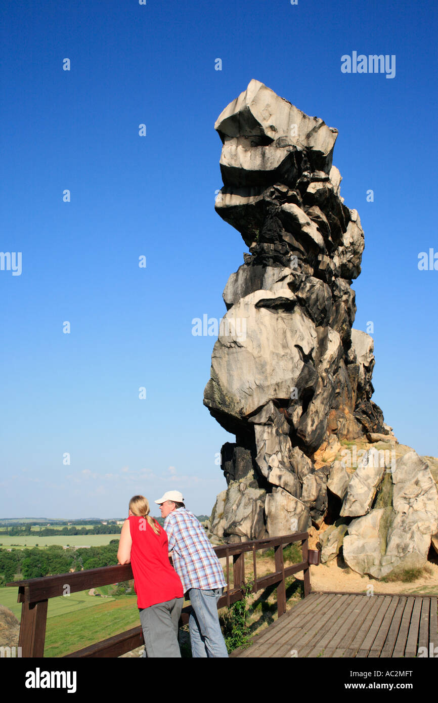 couple enjoying the view beside parts of the so called devil´s wall near Thale in Northern Germany´s Mountain Area Harz Stock Photo