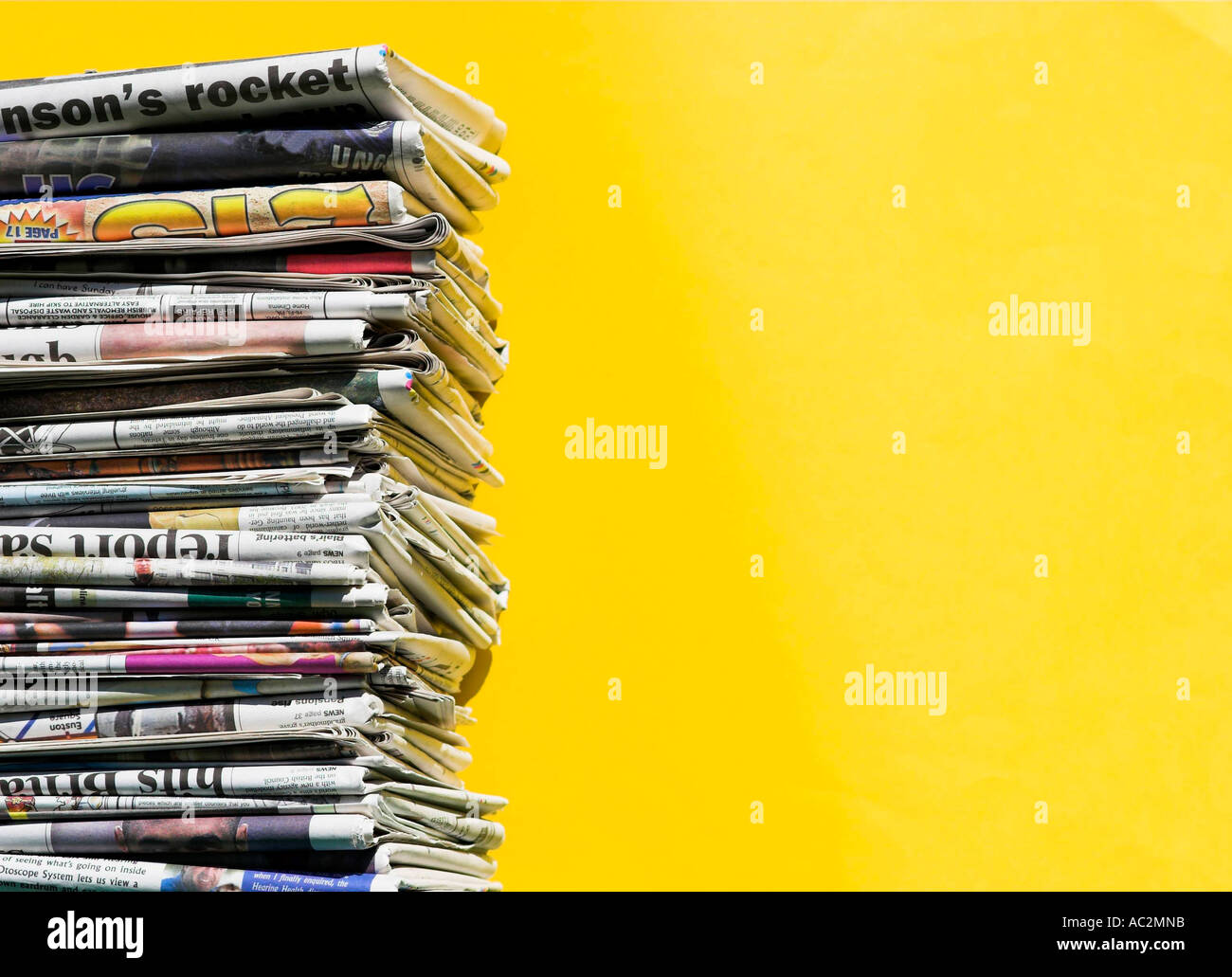 Close-up of a pile of stacked newspapers. Stock Photo