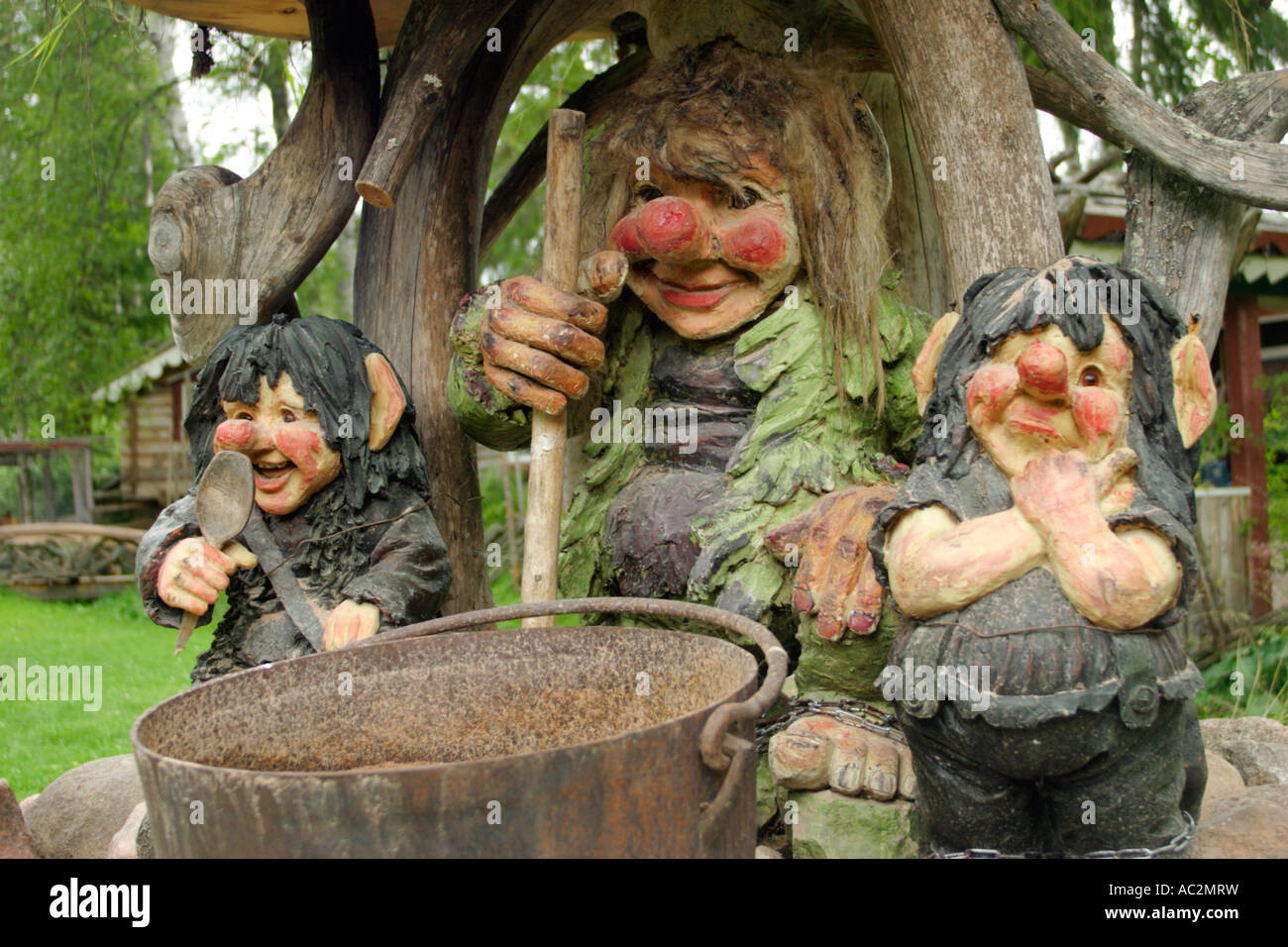 three trolls are preparing food at Valbackens Stugby near Mora in the South of Sweden Stock Photo