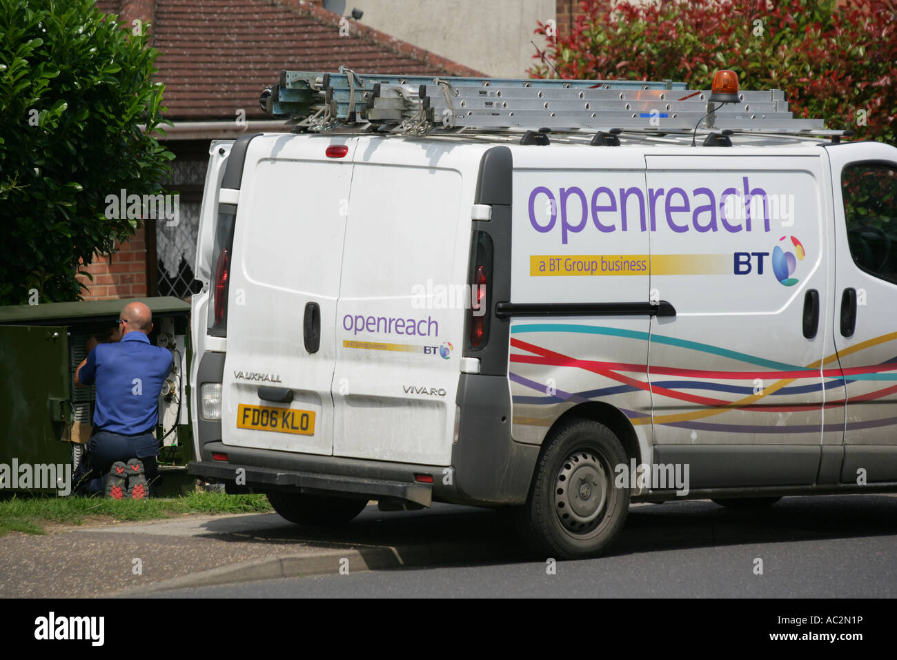British engineer working on phone line exchange box, England UK