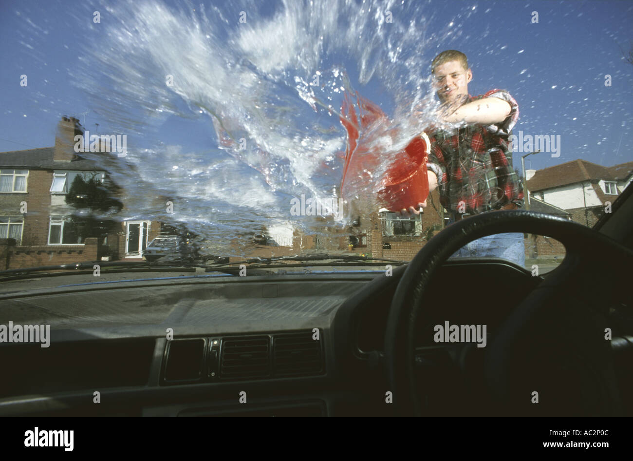Throwing bucket of water hires stock photography and images Alamy