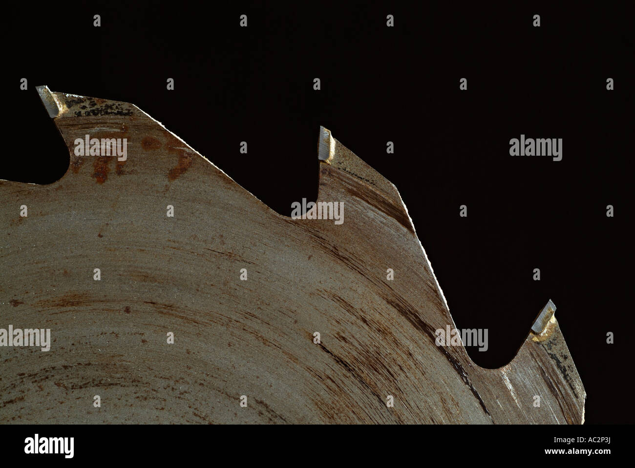 Circular Saw Blade Against a Black Background Stock Photo