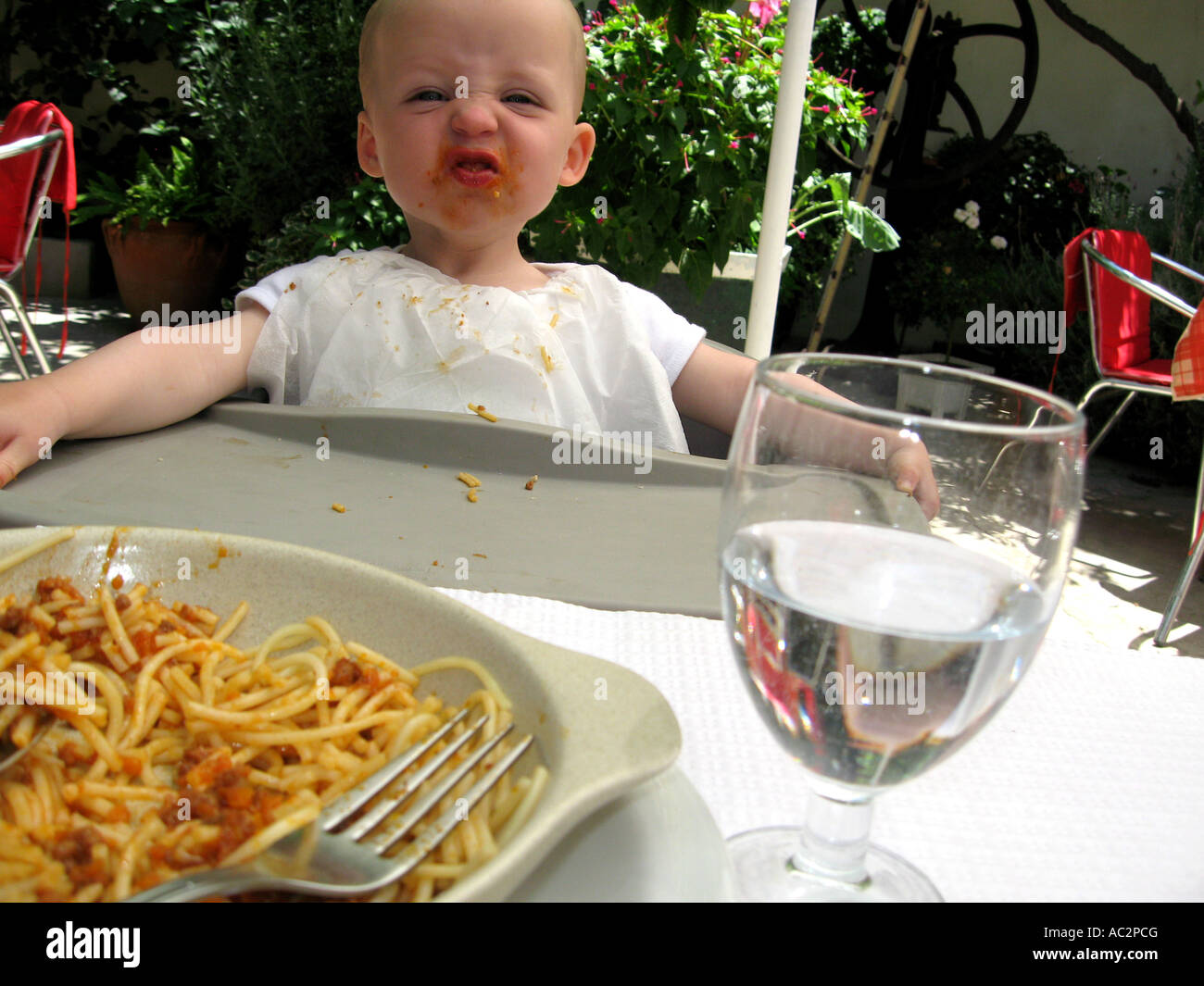 toddler having lunch in al fresco restaurant Stock Photo