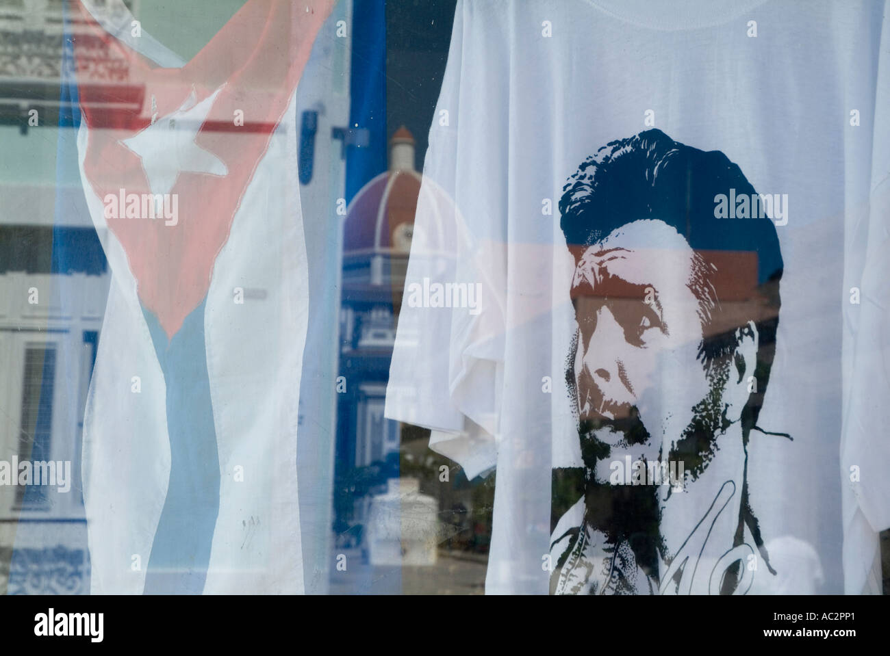 Che Guevara T-shirt and Cuban flag in a store window, Cienfuegos, Cuba. Stock Photo
