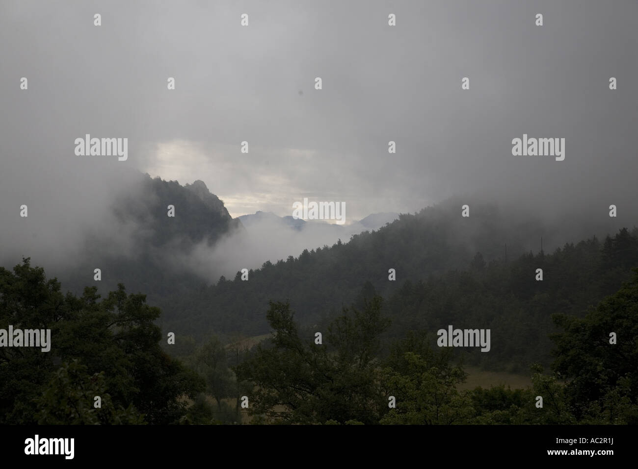Low clouds early in the morning in the mountains of Drôme, France Stock Photo