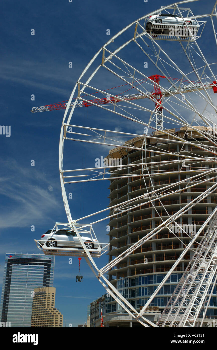 Car ferris wheel with building construction downtown Toronto Stock Photo