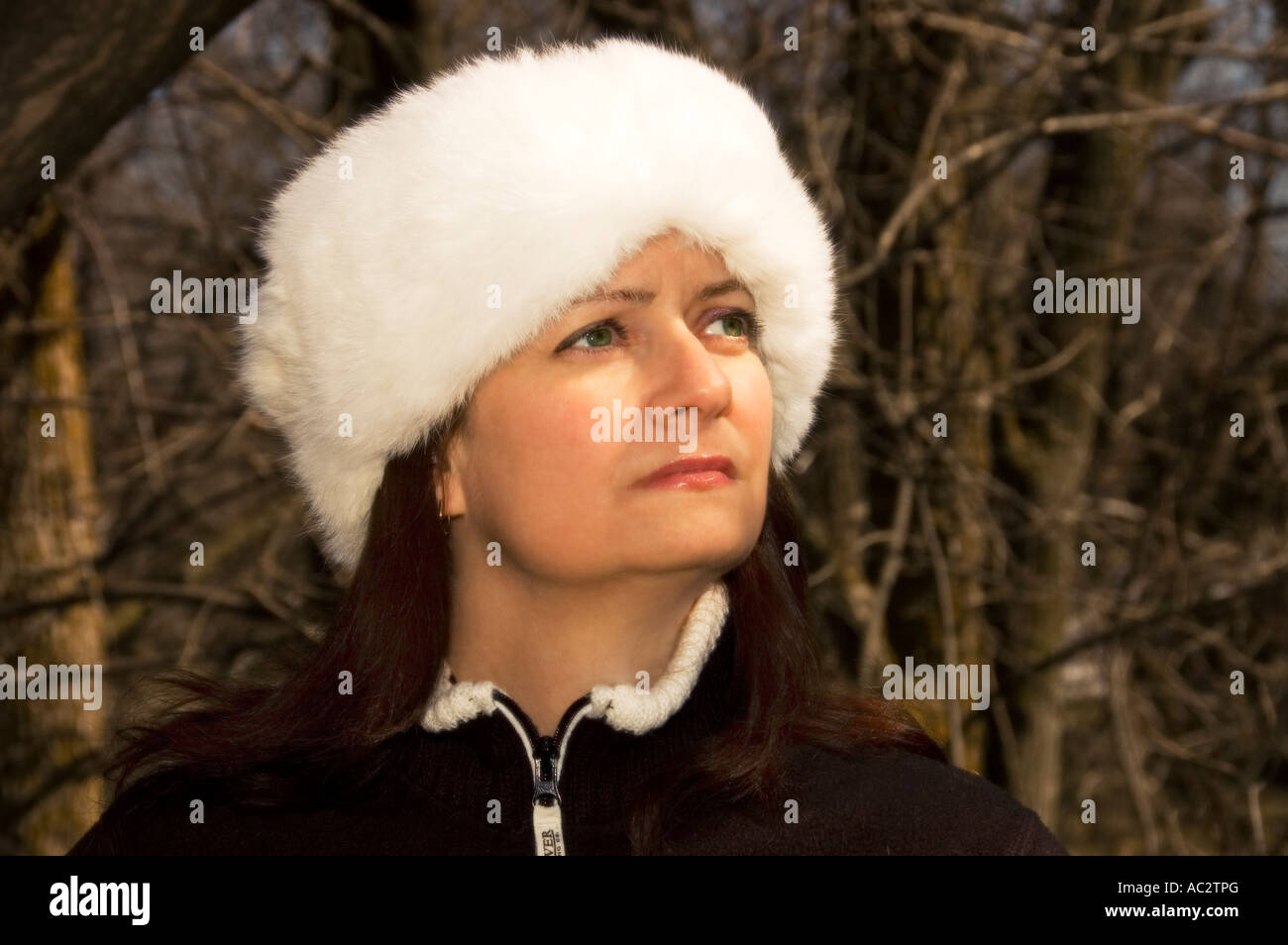 Young woman with a white fur hat Stock Photo