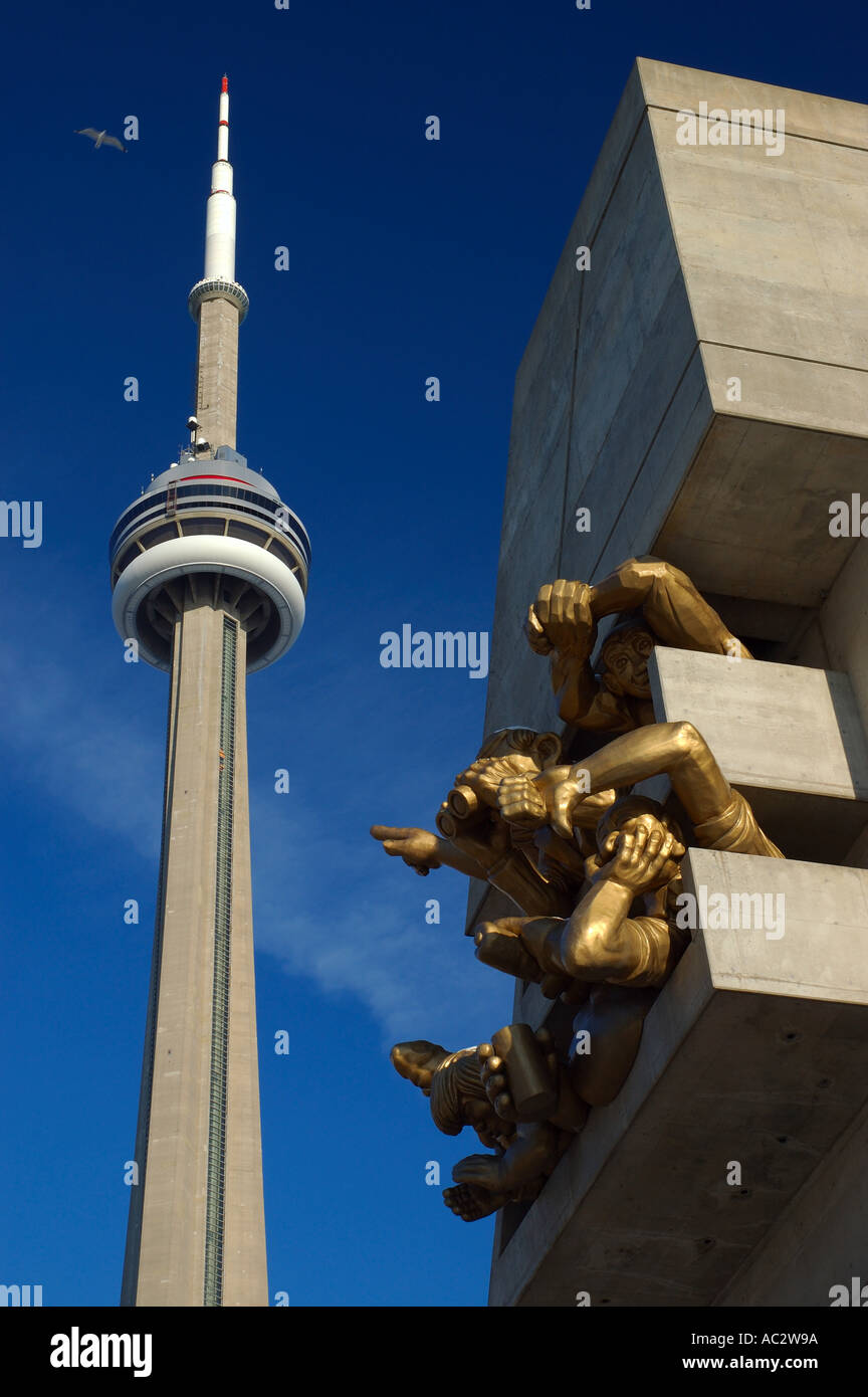 CN tower with sculpture of sports fans at Rogers Center Toronto Stock Photo