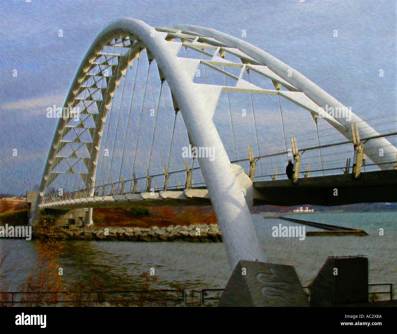 Lone Fall walker on Humber Bay Foot Bridge Toronto Stock Photo