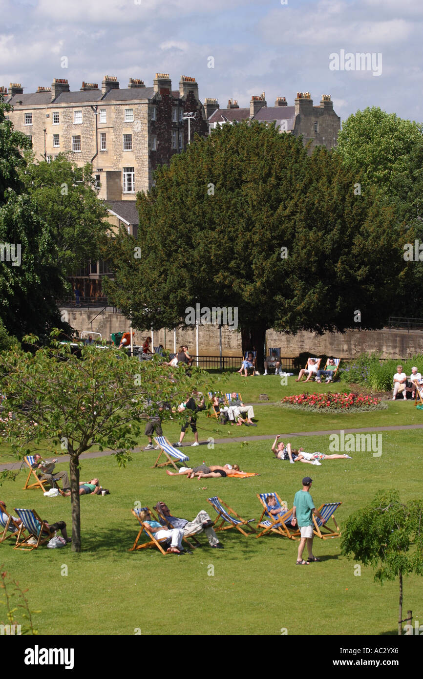 Bath Parade Gardens visitors relax in deckchairs in public garden on