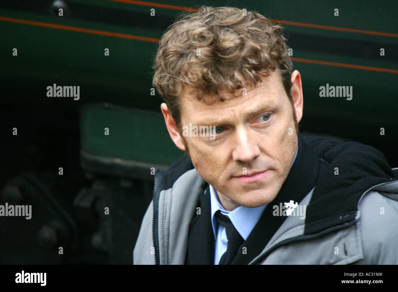 Close head shot of actor on the ITV soap show, Heartbeat resting between takes on Goathland Station. Stock Photo