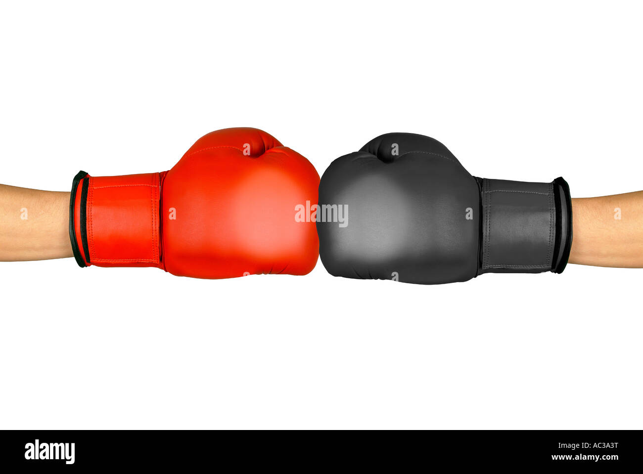 red and black boxing gloves roter und schwarzer Boxhandschuh gegeneinander Stock Photo