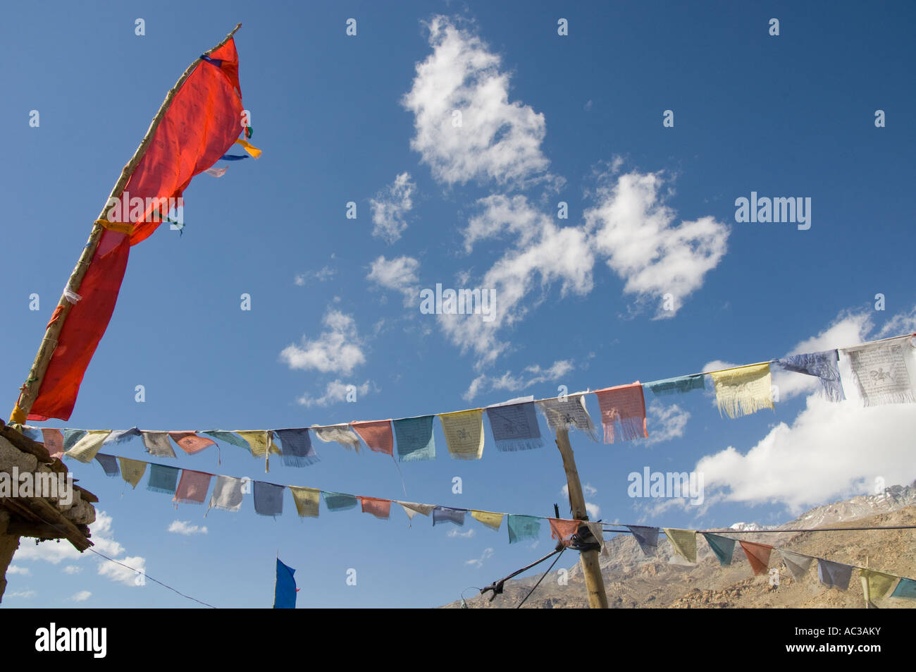 India Himachal Pradesh Spiti Nako village 2950m close up of traditional prayer flags with light white clud in blue sky Stock Photo