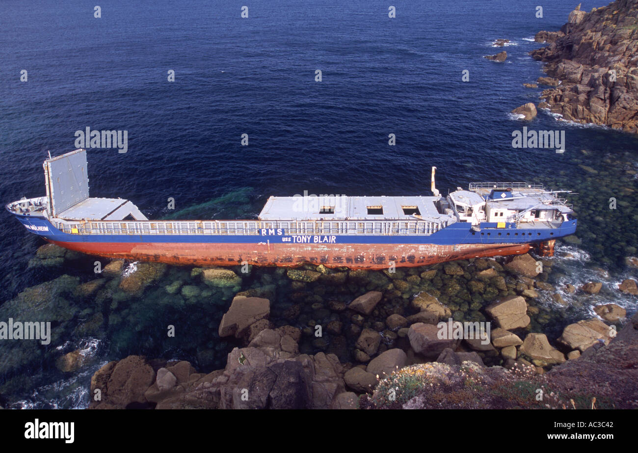 Wrecked ship daubed with a political slogan nr Land s End Cornwall Great Britain Stock Photo