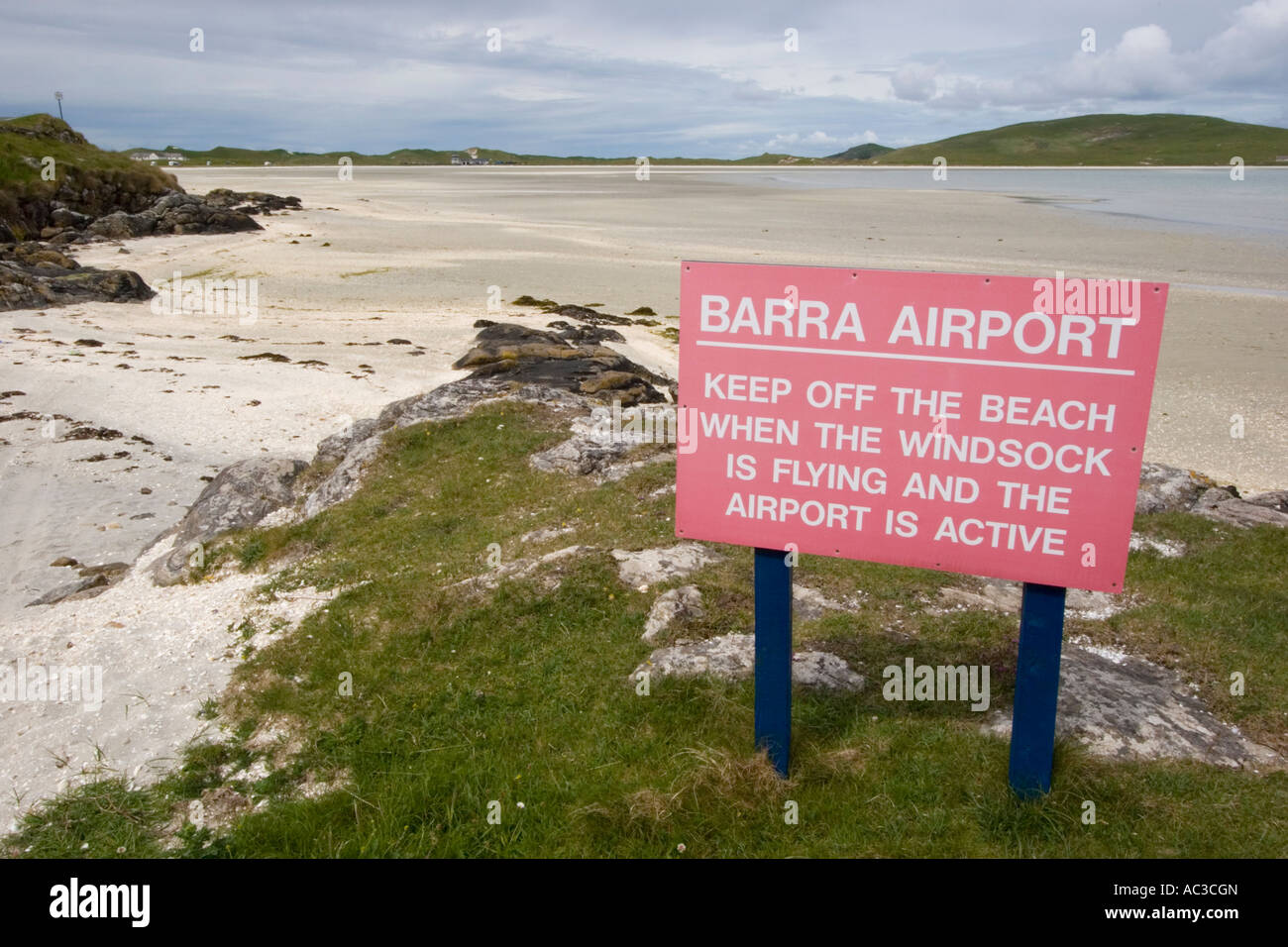 Barra airport sign by the beach where the planes land and take off at low tide Stock Photo