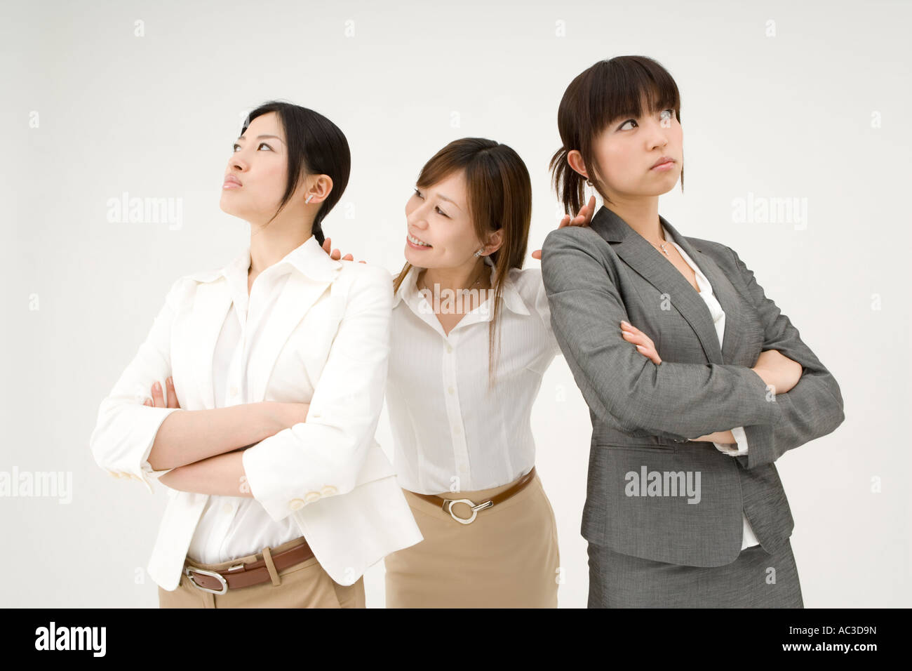 Businesswomen looking away from each other Stock Photo - Alamy