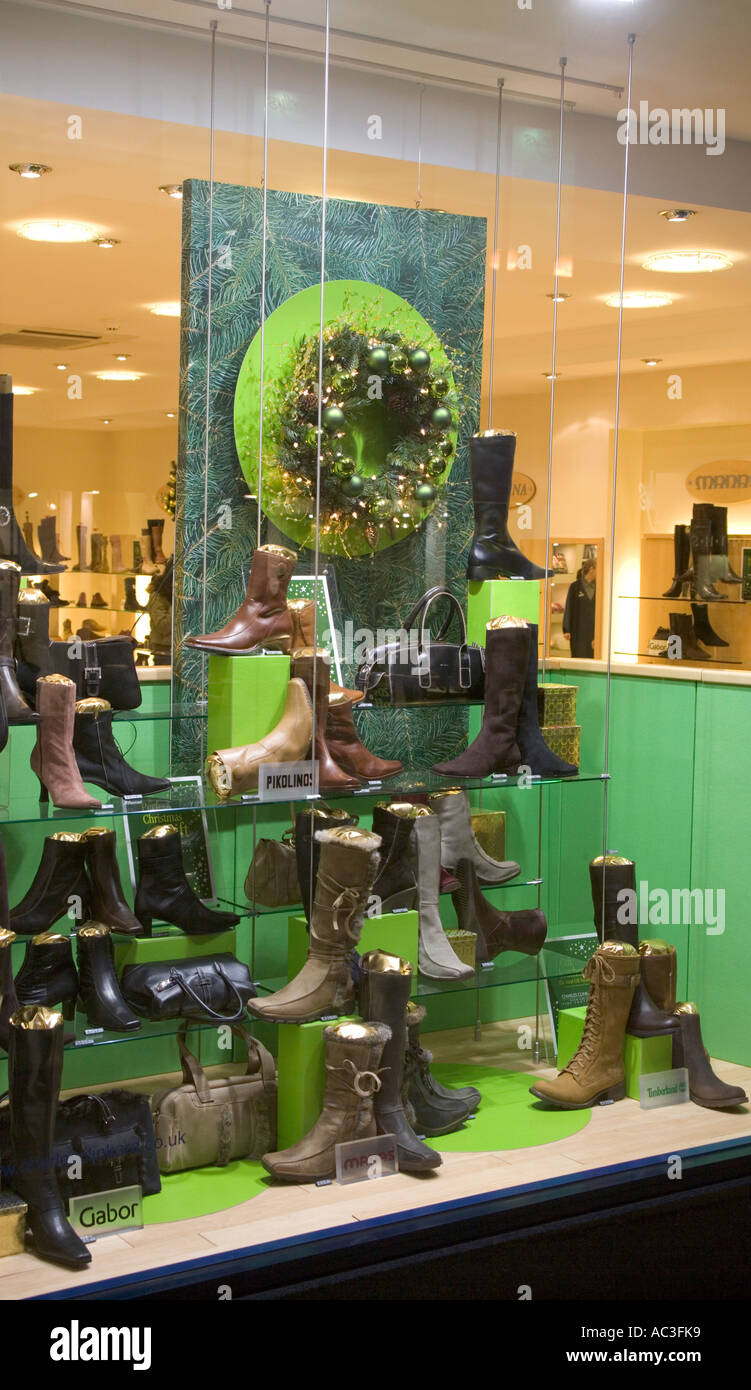 Ladies and Mens assorted boot in Shop Window Display,UK,GB Christmas time, Stock Photo
