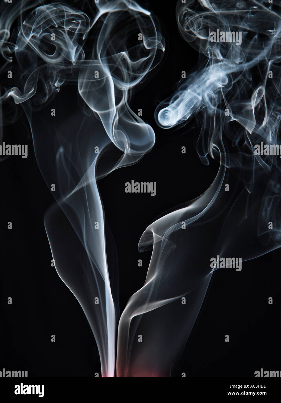 Smoke rising from extinguished candles in a dark room Stock Photo Alamy