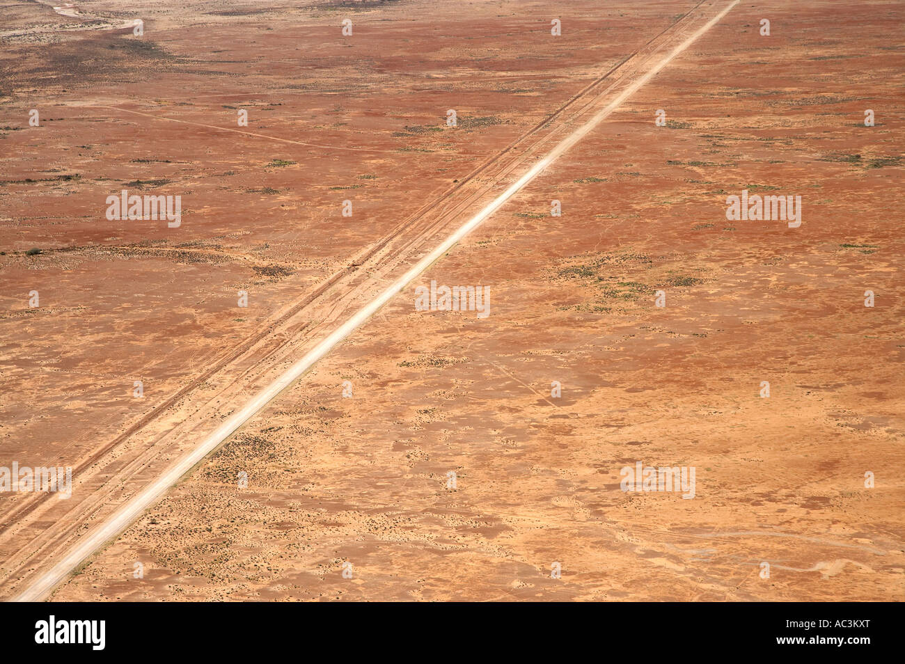 Oodnadatta Track and Old Ghan Train Line near William Creek Outback South Australia Australia aerial Stock Photo
