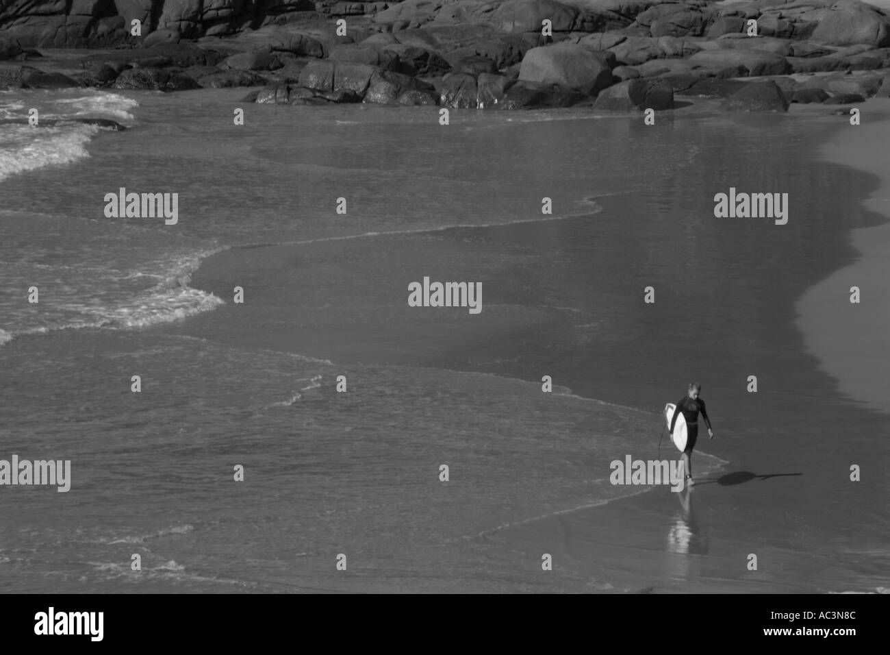 Australian Surfer On Beach Black and White Stock Photo