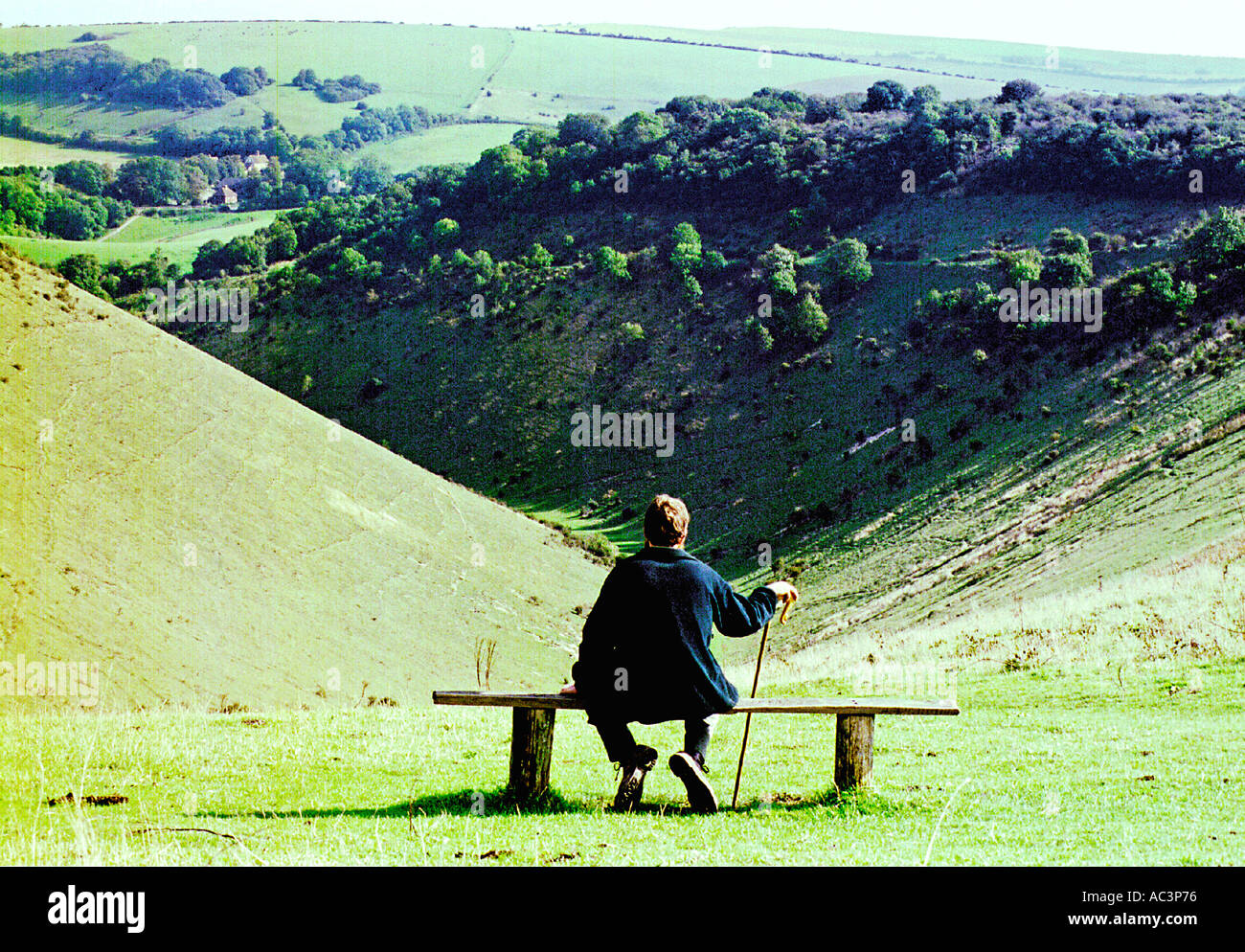 Protecting the environment. A National Trust warden surveys the South Downs at Devil's Dyke in Sussex Stock Photo