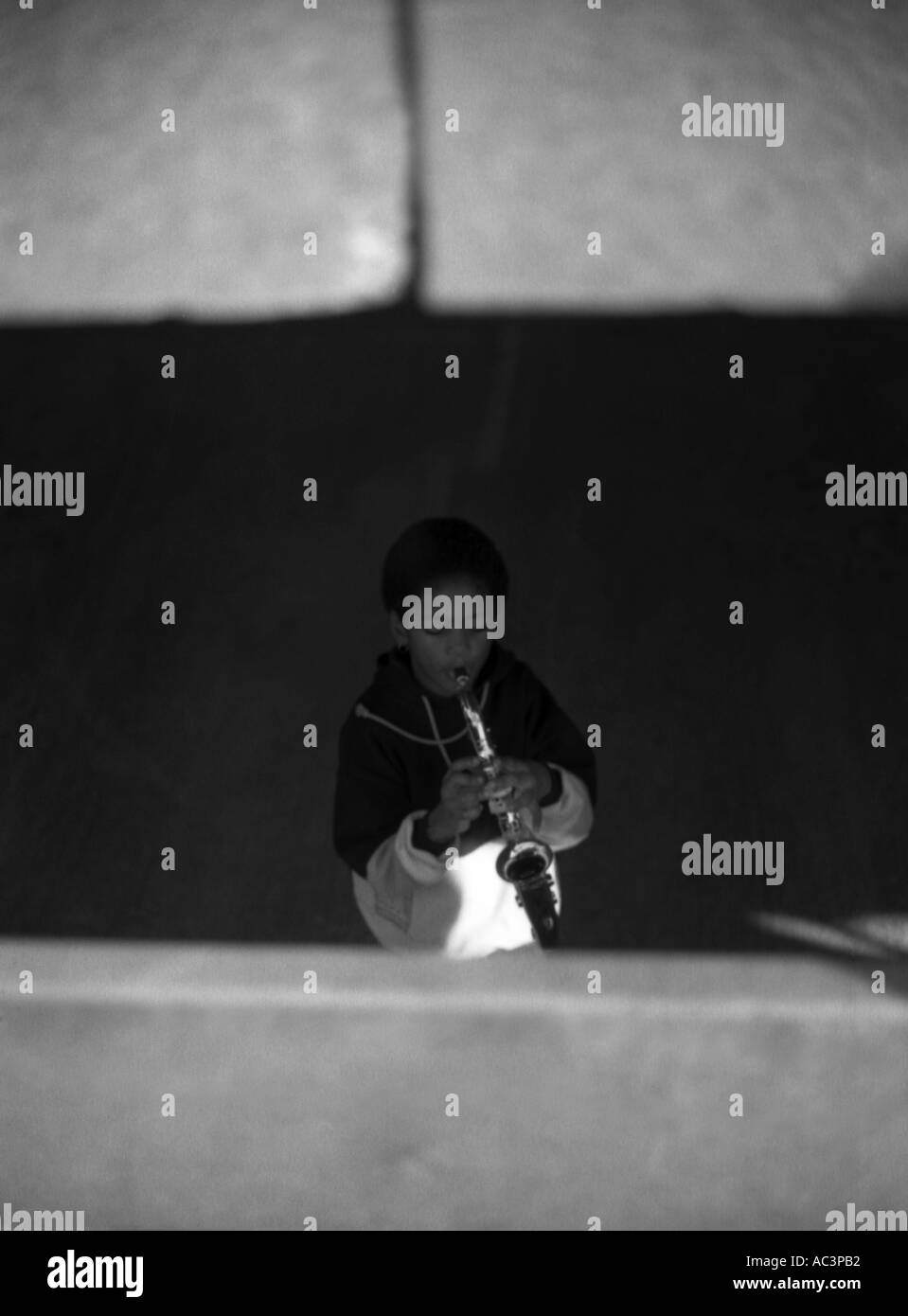 Boy playing a saxophone hi-res stock photography and images - Alamy