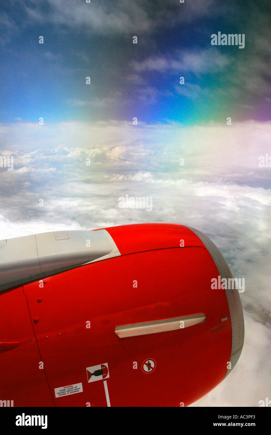Jet Aircraft window view of engine polarised blue sky and clouds over ...