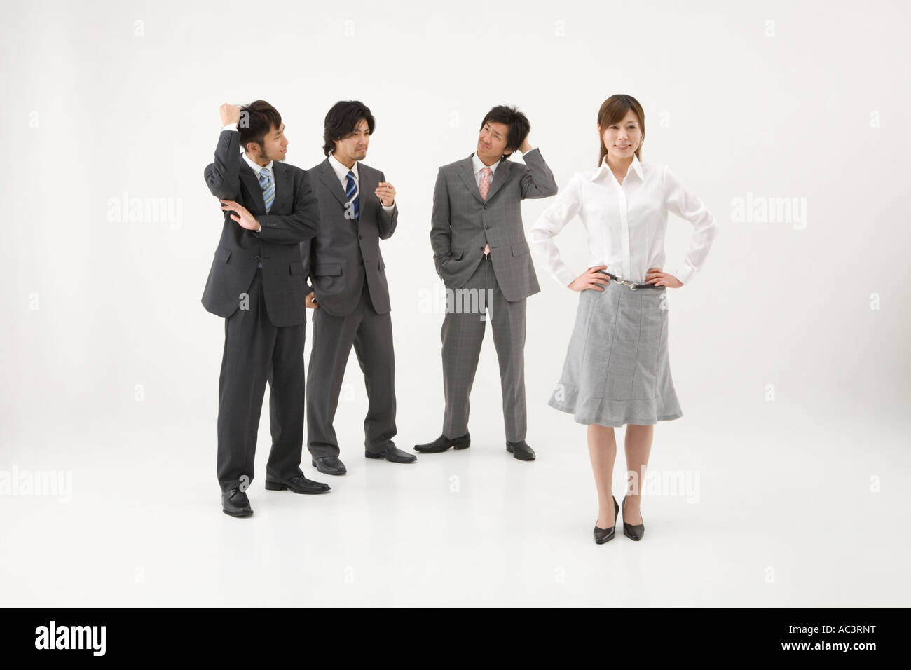 Businesswoman and three businessmen Stock Photo