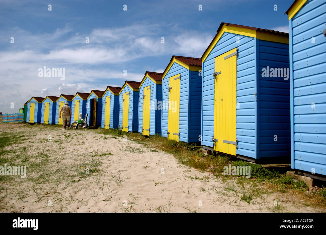 Blue and yellow beach huts on Littlehampton seafront UK Stock Photo Alamy