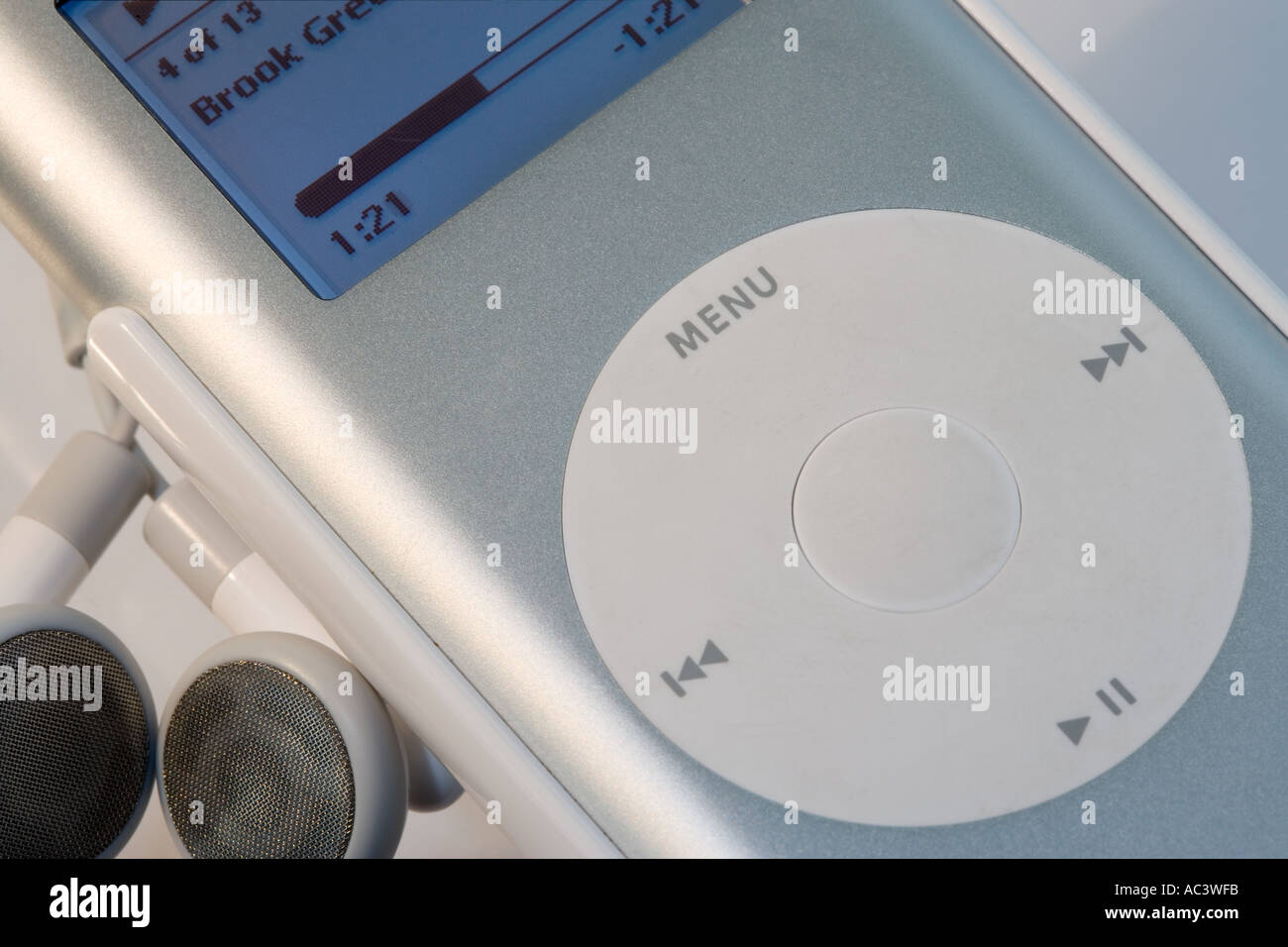 Close up of iPod and headphones with music playing Stock Photo