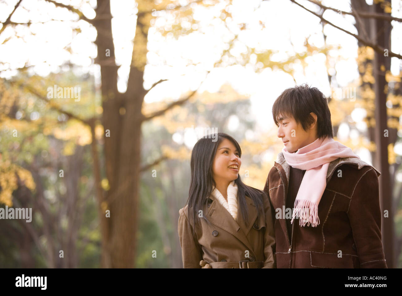 Young couple looking at each other Stock Photo - Alamy