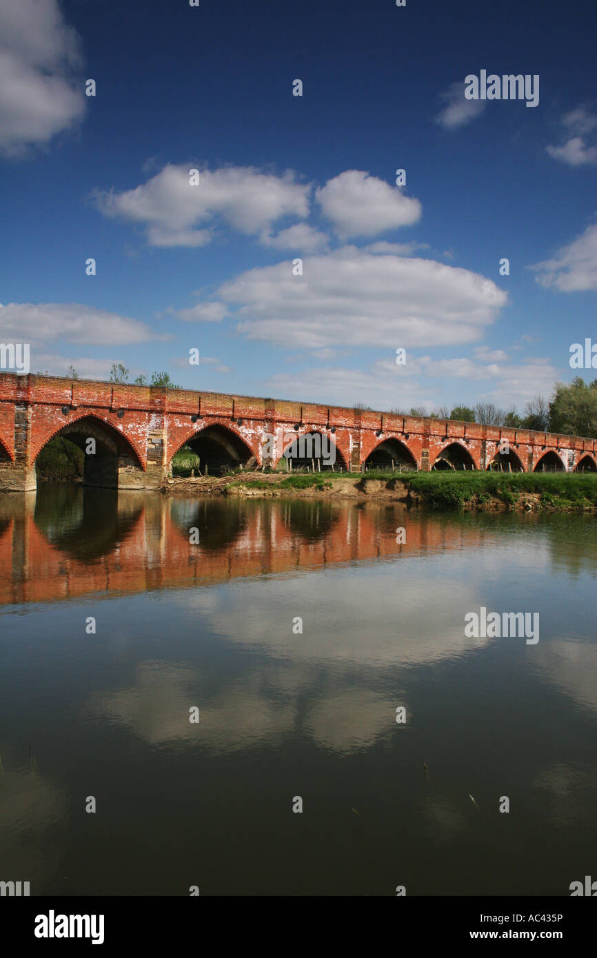 Great Barford bridge spanning River Great Ouse, Bedfordshire. Portrait. Full colour. Stock Photo
