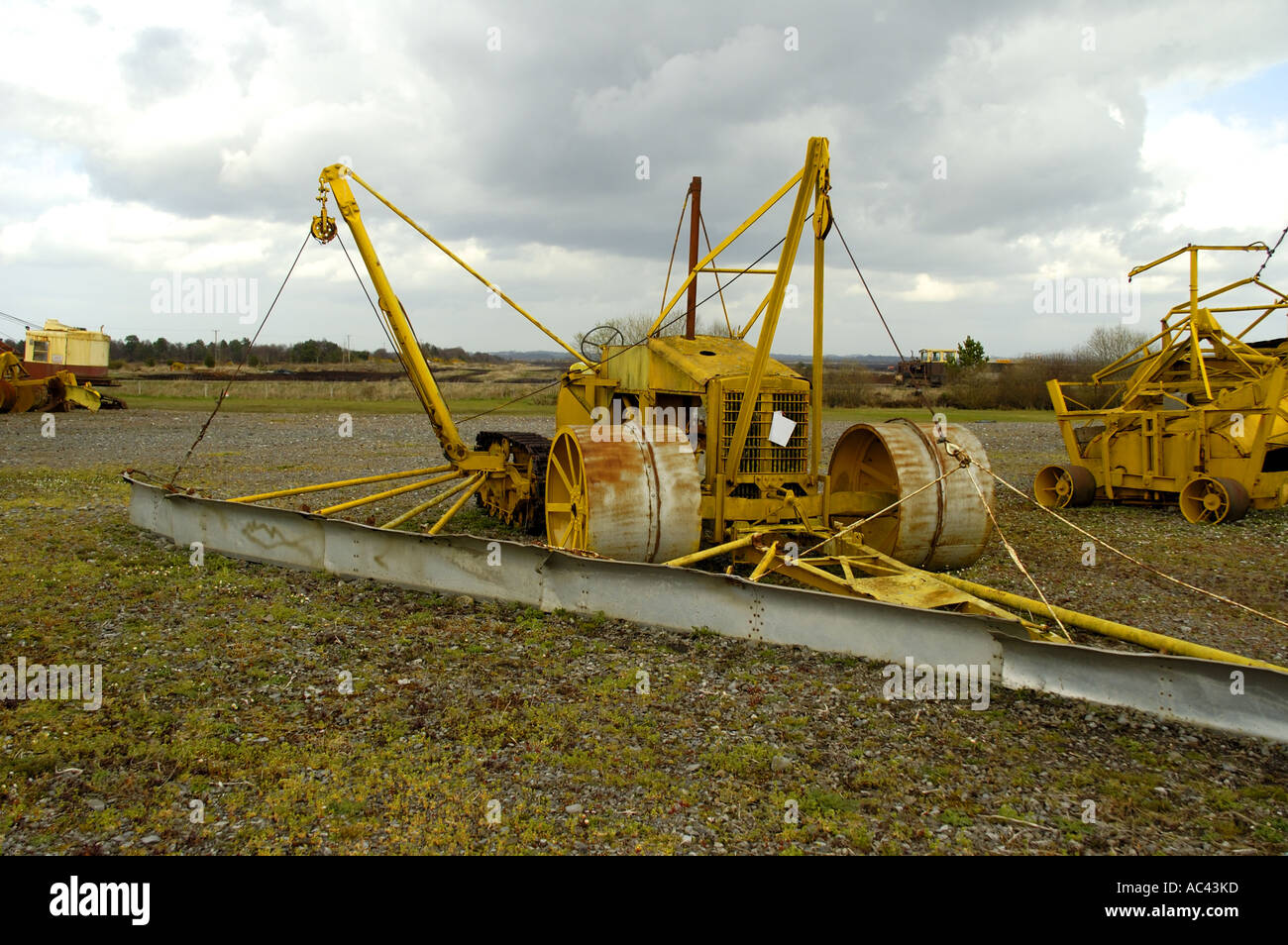 Machinery used for the industrial harvesting of peat at Blackwater Bog Co Offaly Ireland Stock Photo