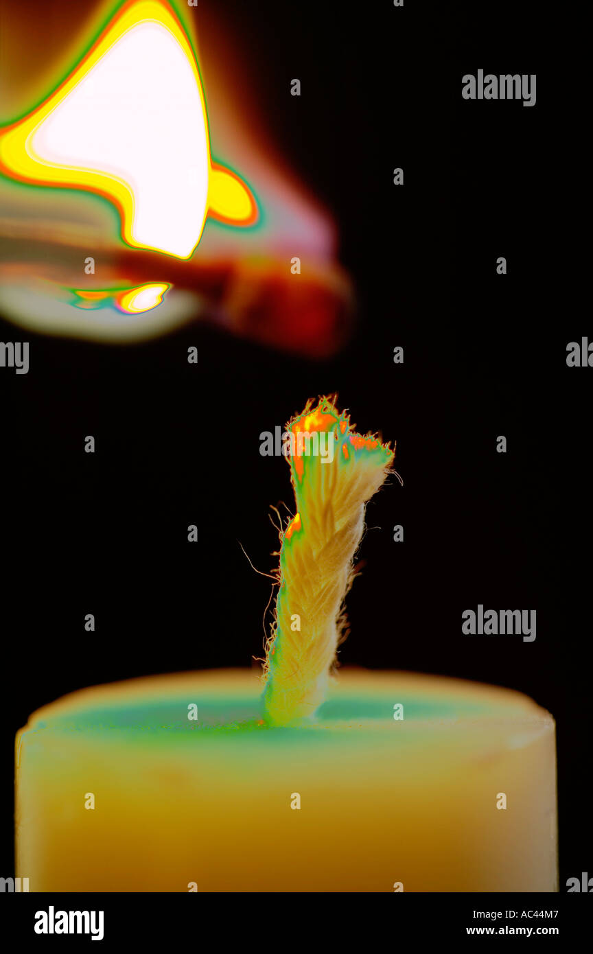 lighting a candle with a match Stock Photo Alamy
