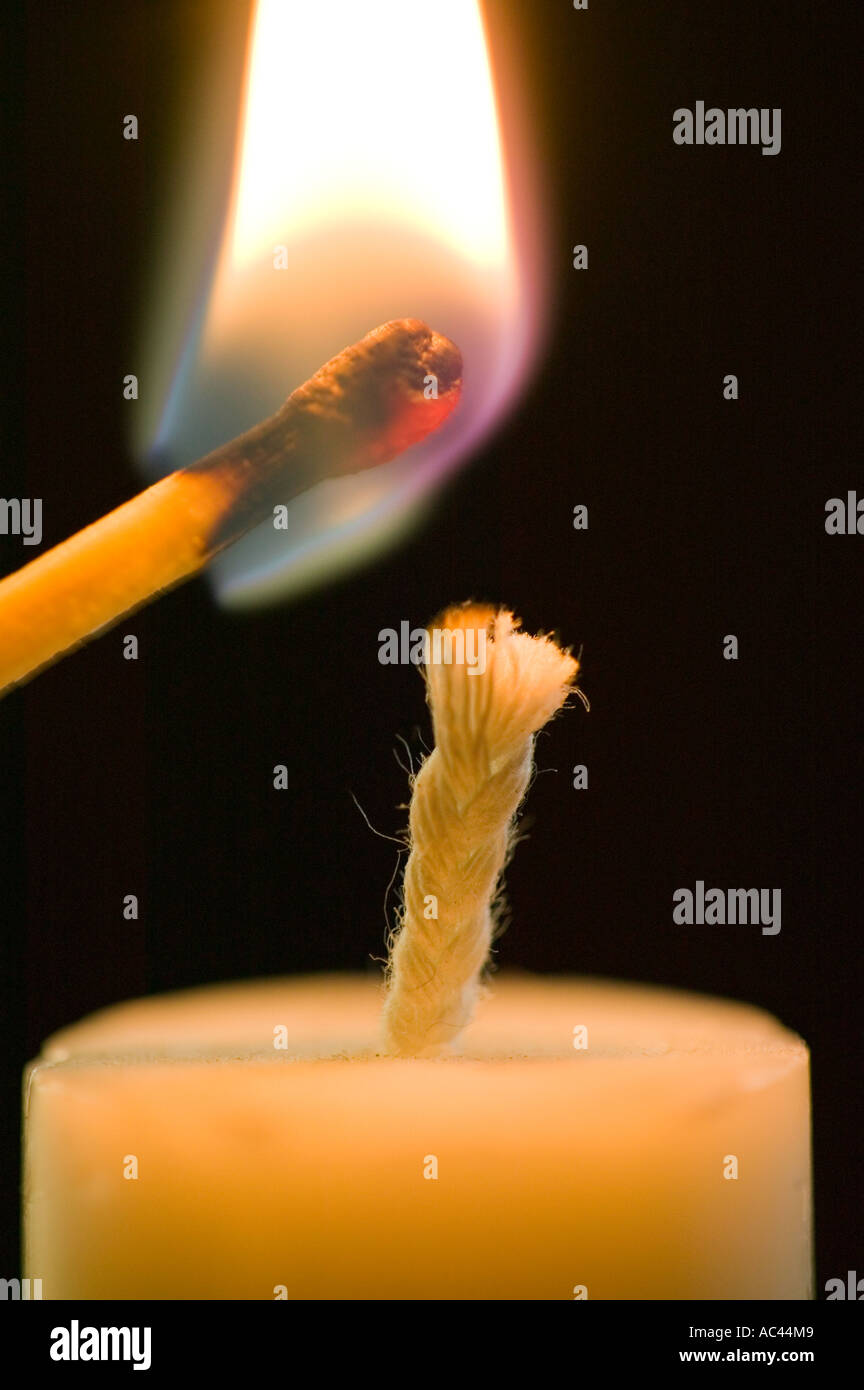 lighting a candle with a match Stock Photo Alamy