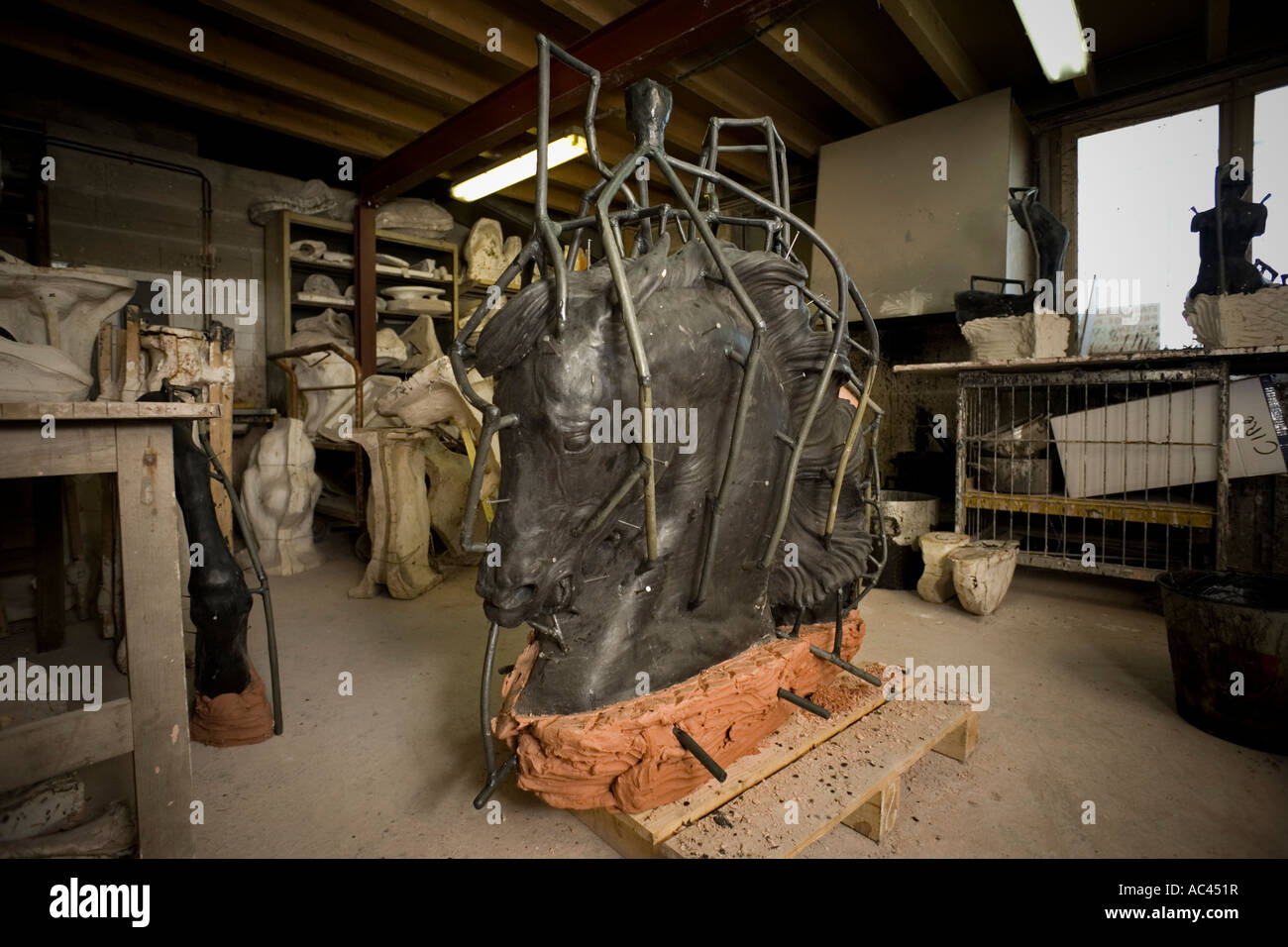 A waxwork mould of an equestrian statue section before casting. Moule en cire d'une portion de statue équestre avant coulée. Stock Photo