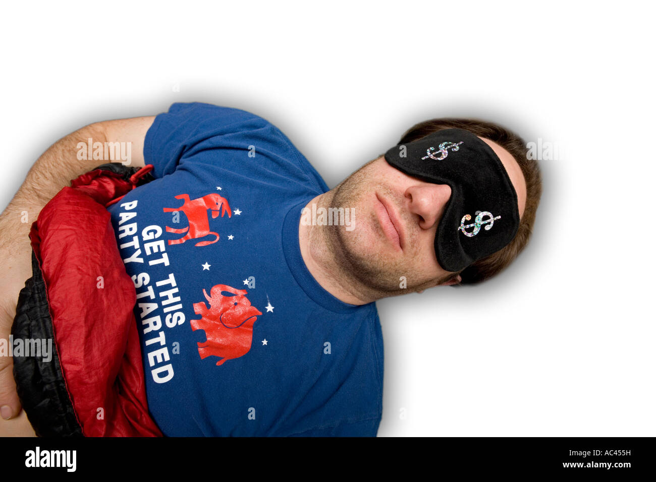 A badly shaved young man sleeping with a mask. Jeune homme dormant avec un masque occultant la lumière. Stock Photo
