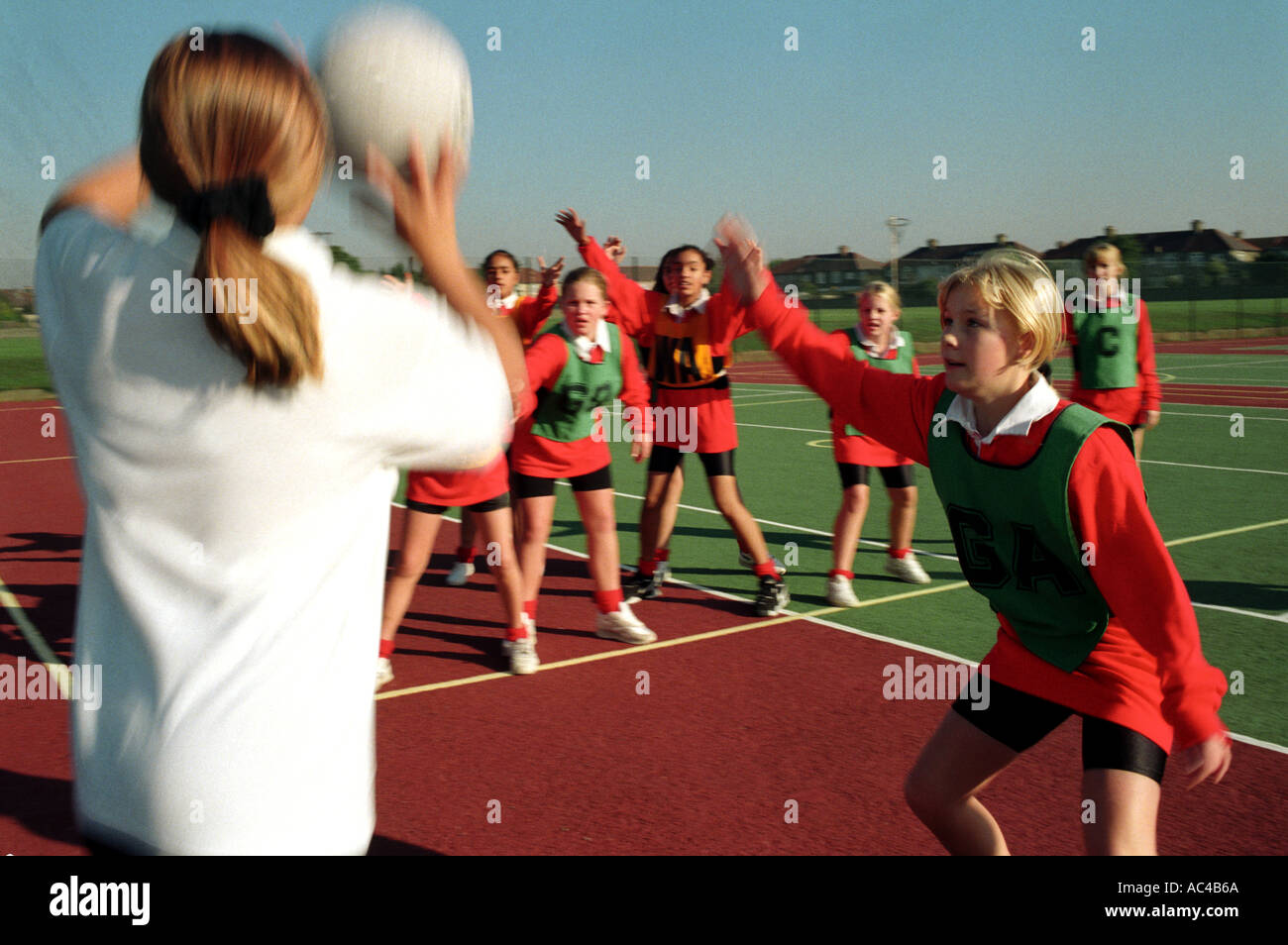 Females playing Basketball / netball at a secondary school Stock Photo