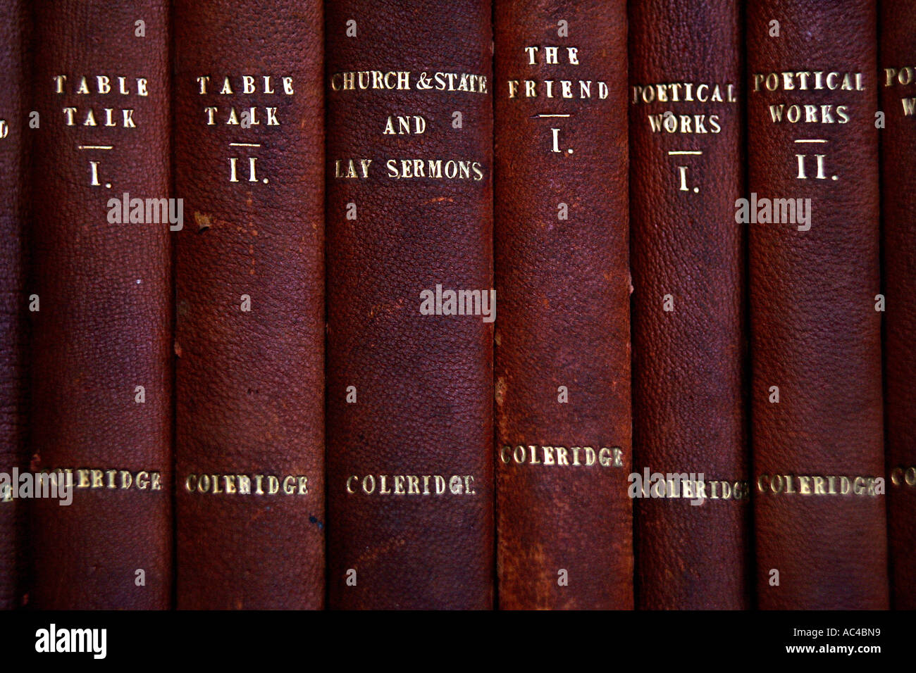 Leather bound copies of Coleridge's work on the bookshelves of the Library at The Chanter's House, Ottery St Mary in Devon UK Stock Photo