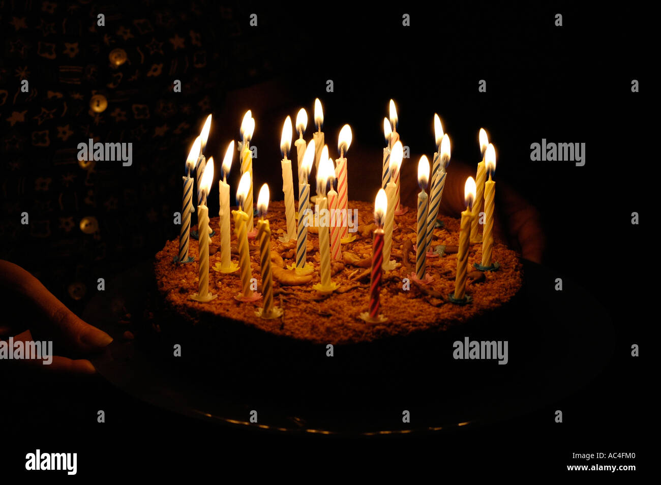 birthday cake with candles in dark Stock Photo - Alamy