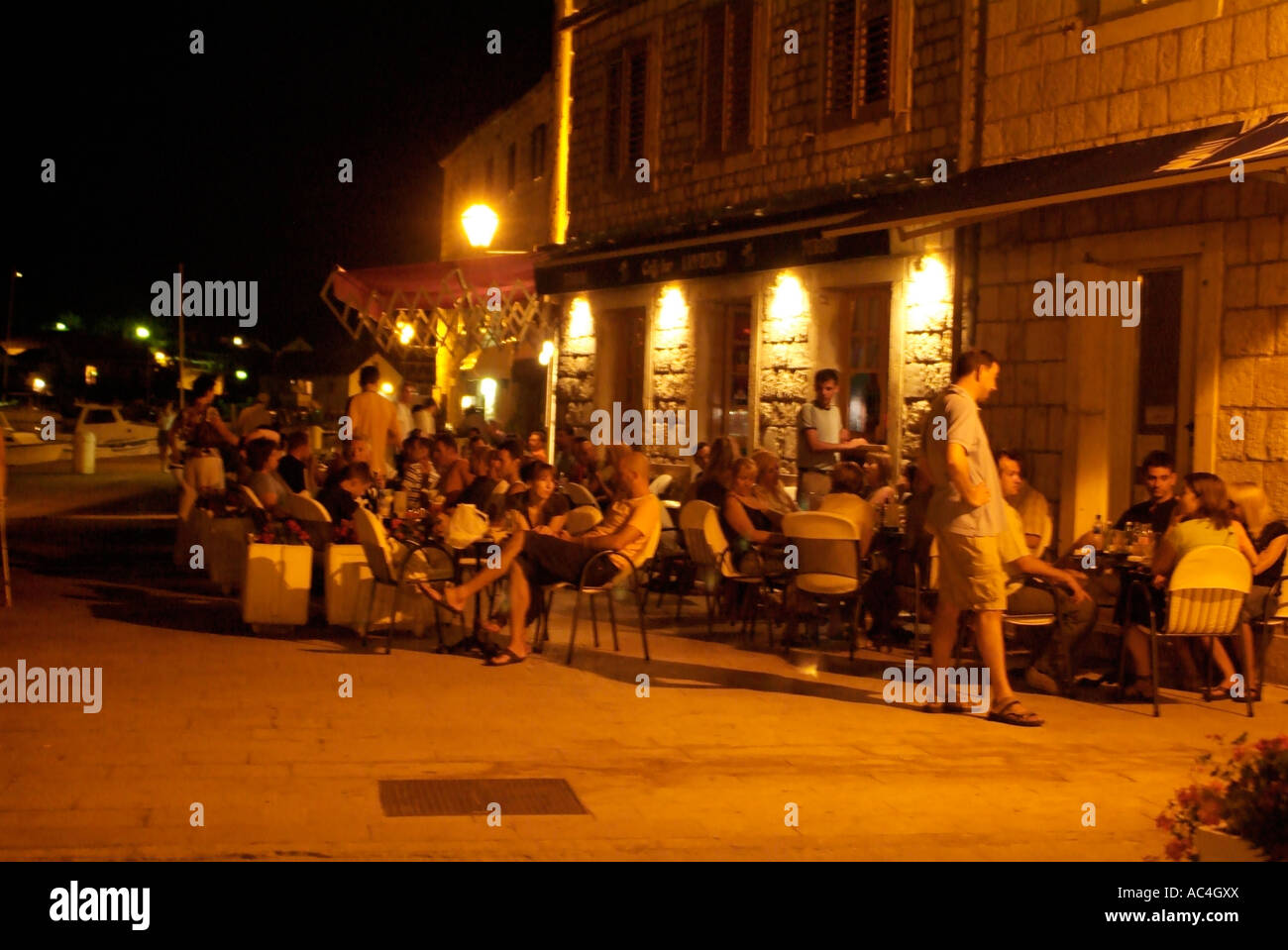 Outdoor bar in Stari Grad at night on Island of Hvar, Croatia Stock Photo
