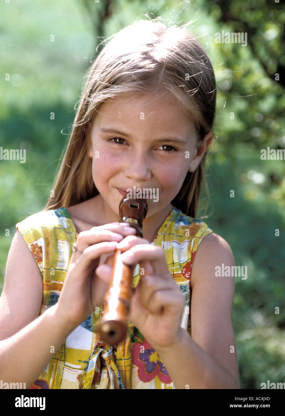 girl playing flute Stock Photo Alamy
