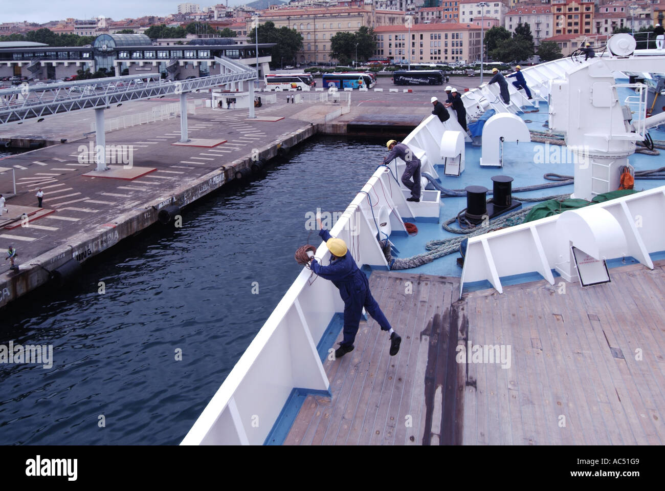 Cruise liner docking procedure seaman throwing weighted ball & thin