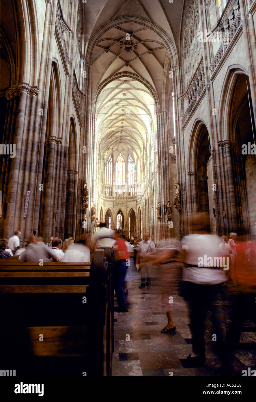 CZECHOSLOVAKIA PRAGUE INSIDE SAINT VITUS CATHEDRAL WHERE MANY FOREIGN VISITORS CONE TO PRAY  Stock Photo